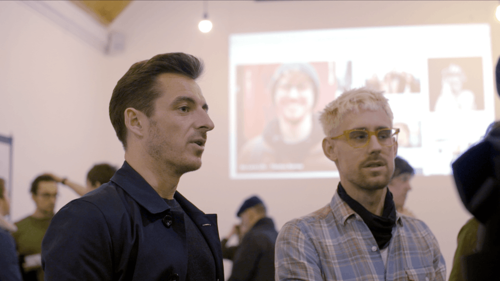 Leighton talks to guests at the exhibition