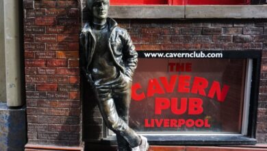 Liverpool's Most Famous Statues Are Wearing Bowling Shoes And Here's Why 1
