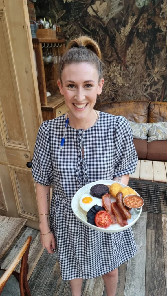 Liverpool’s Beloved Bistro The Watering Can Celebrates 100,000 Full English Breakfasts Served 2 The Watering Cans Amy Beattie, Restaurant Manager with Full English Breakfast