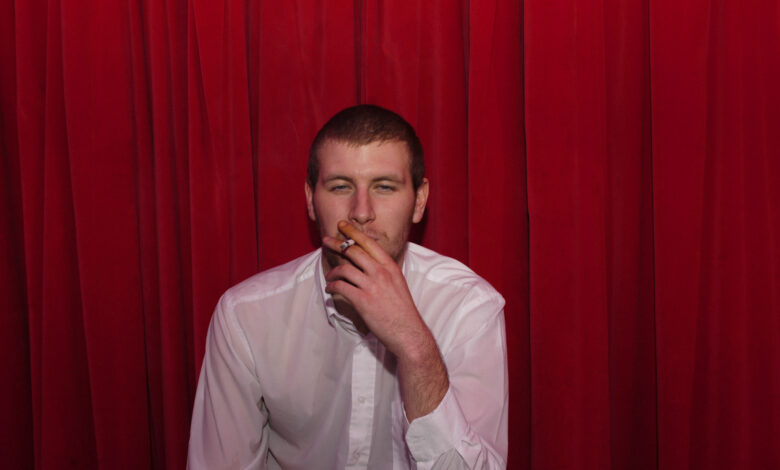 New British Music Experience Exhibition Explores The Artwork Behind Arctic Monkeys’ Iconic Debut Album 21 Don't Believe The Hype Exhibition - Colour photo of Chris McClure. Credit Alexandra Wolkowicz