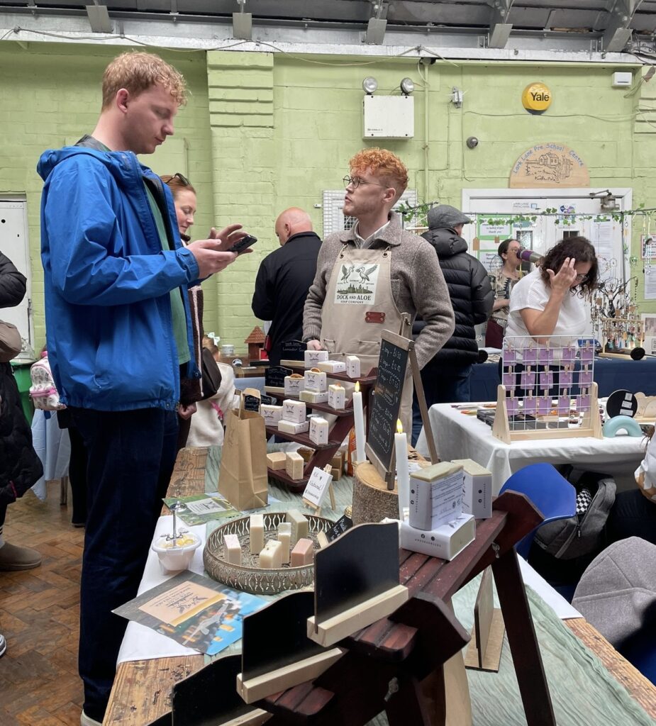 People browsing a stall at Liverpool Makers Bazaar