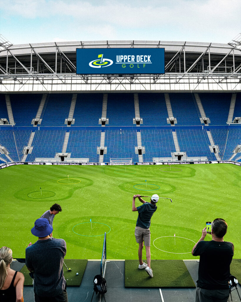 Tee Off Inside Everton's Hill Dickinson Stadium This Summer 2 A person playing golf at Hill Dickson Football Stadium